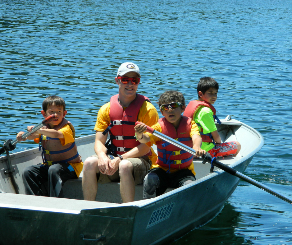 Campers rowing with their counselor on the Reservoir