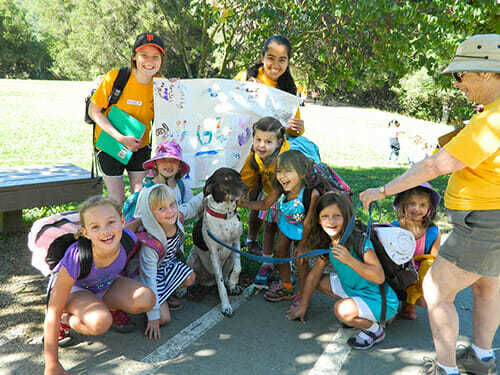 1 Grade Girls Pose as a Group with their Flag