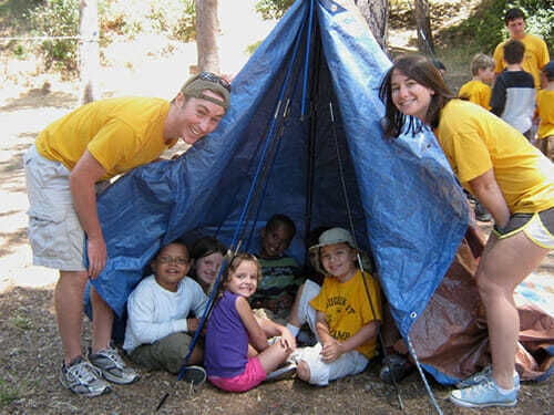 Young Campers Pitch a Tent in Outdoors