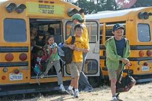 Counselor Greets Campers off the Morning Bus