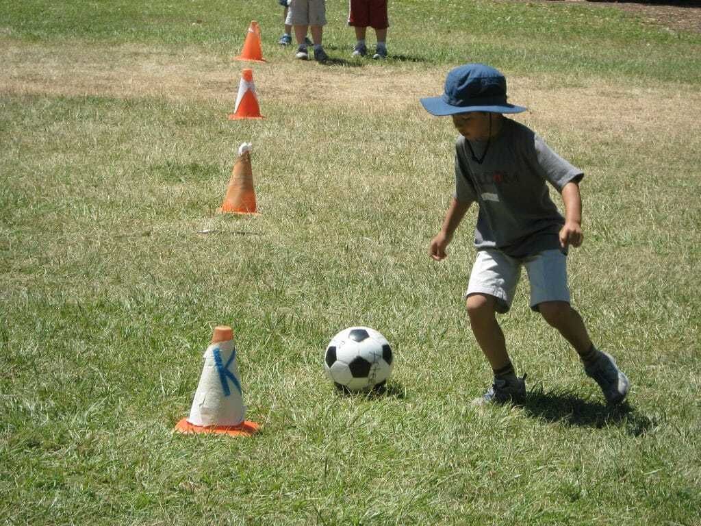 Camper learning new soccer skills at sports
