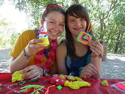 Teen Camper Shows off Clay Figure in Crafts