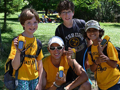 Young Boy Campers Hold Geocaching Devices