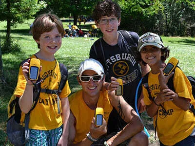 Young Boy Campers Hold Geocaching Devices