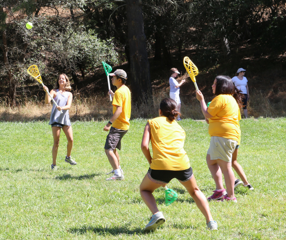 Campers learning lacrosse at sports