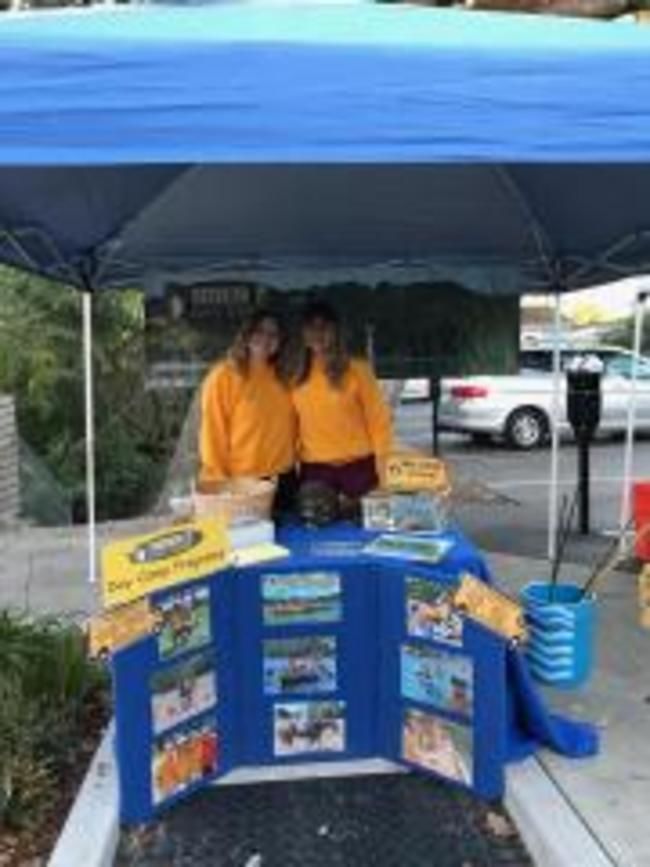 Roughing It day camp counselors working booth at lafayette reservoir run for education 