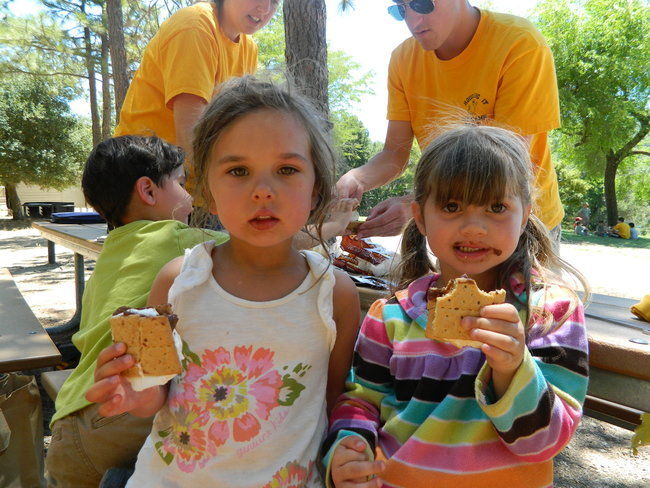 Bring on s'more camp learning - pre-k campers enjoy eating s'mores they made themselves.