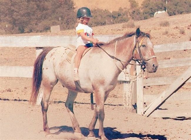 Camper riding a horse.