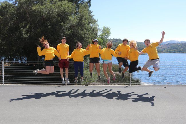 counselros at Roughing It Day Camp jumping for joy at the lafayette reservoir 