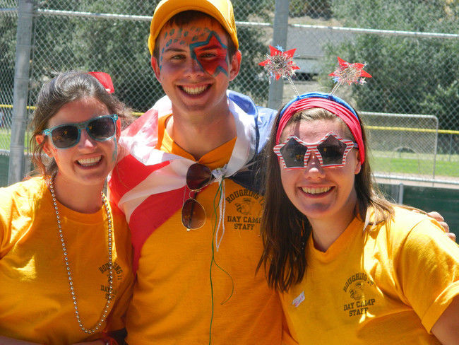 counselros at roughing it day camp dressed up with face paint for fourth of july