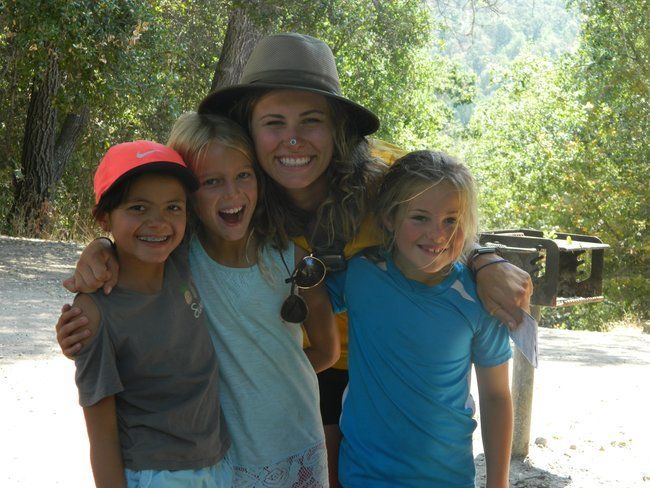 counselor and campers at roughing it day camp smiling together at the lafayette reservoir 