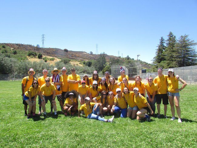 all counselors posing together on the fourth of july roughing it day camp family picnic