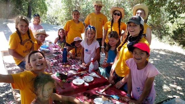 Campers and Counselors dressed up for western day, doing crafts at the Lafayette Reservoir