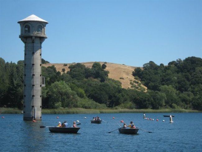 campers and counsleors row boating around the lafayette reservoir