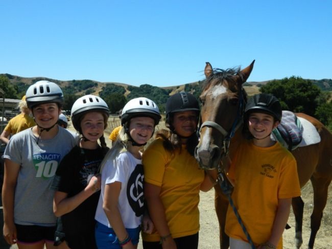 campers at roughing it day camp at the lafayette reservoir having fun with counselor during dress up day 