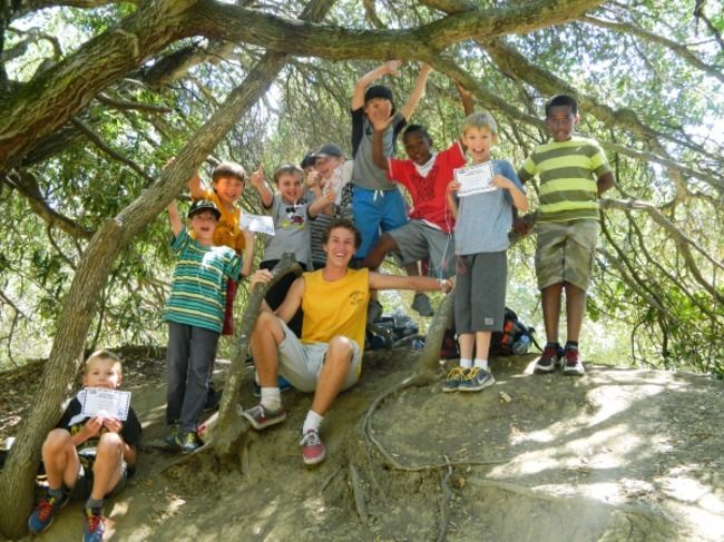 campers at roughing it day camp at the lafayette reservoir having fun with counselor hugging