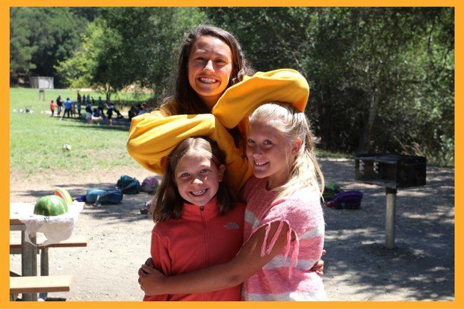 camper and counselor having fun together at roughing it day camp at the lafayette reservoir 