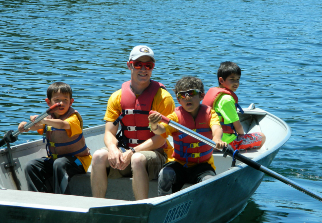 Campers rowing with their counselor on the Reservoir